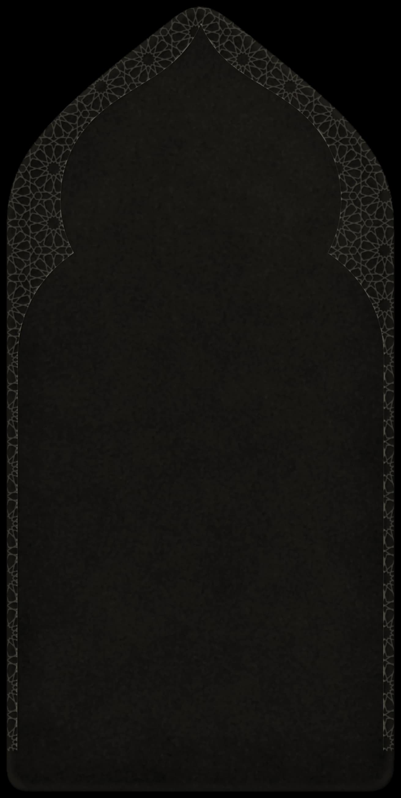 A deep charcoal velvet prayer mat, cut to a mihrab arch, framed by an interlacing geometric star pattern